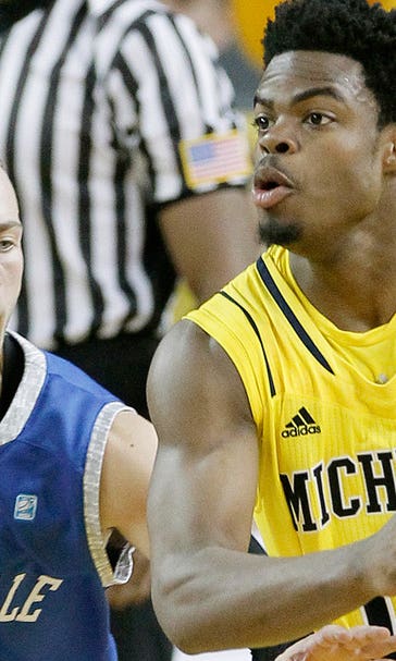 No. 24 Michigan eases past Hillsdale after raising banner
